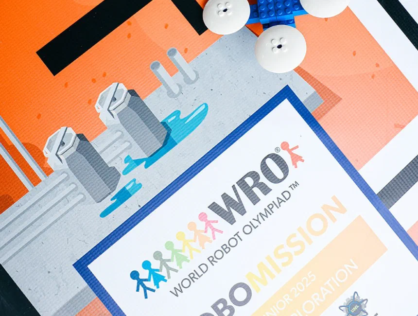 Students preparing robots on a World Robot Olympiad competition table