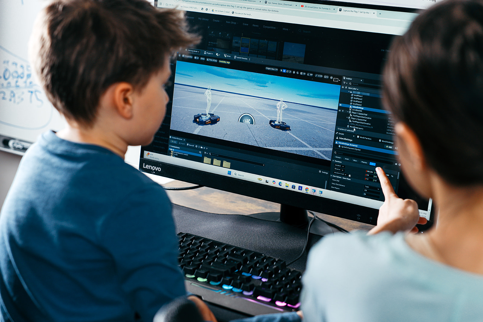 Dorina and Maxwell working on Fortnite game development in Unreal Engine